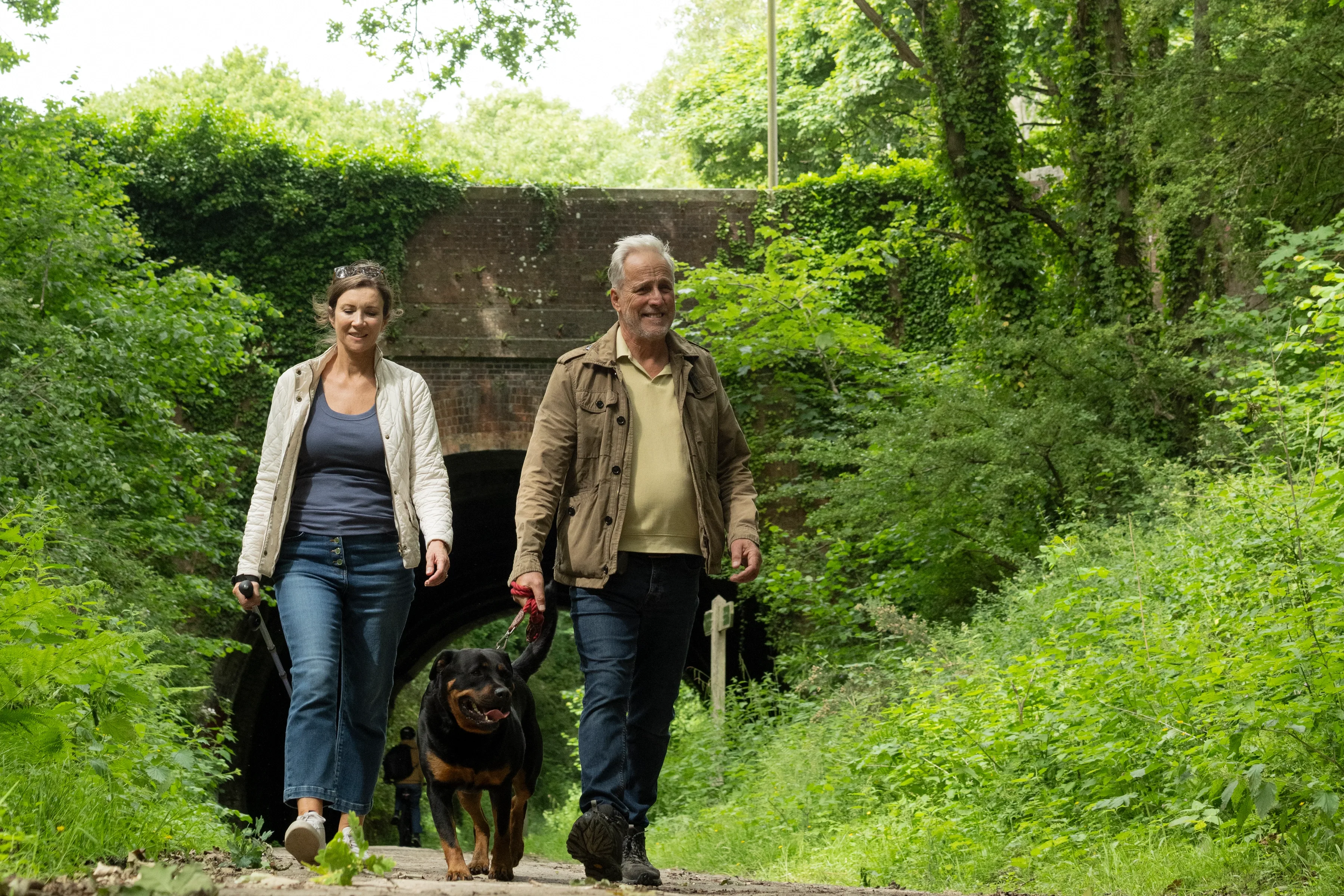 Couple dog walking