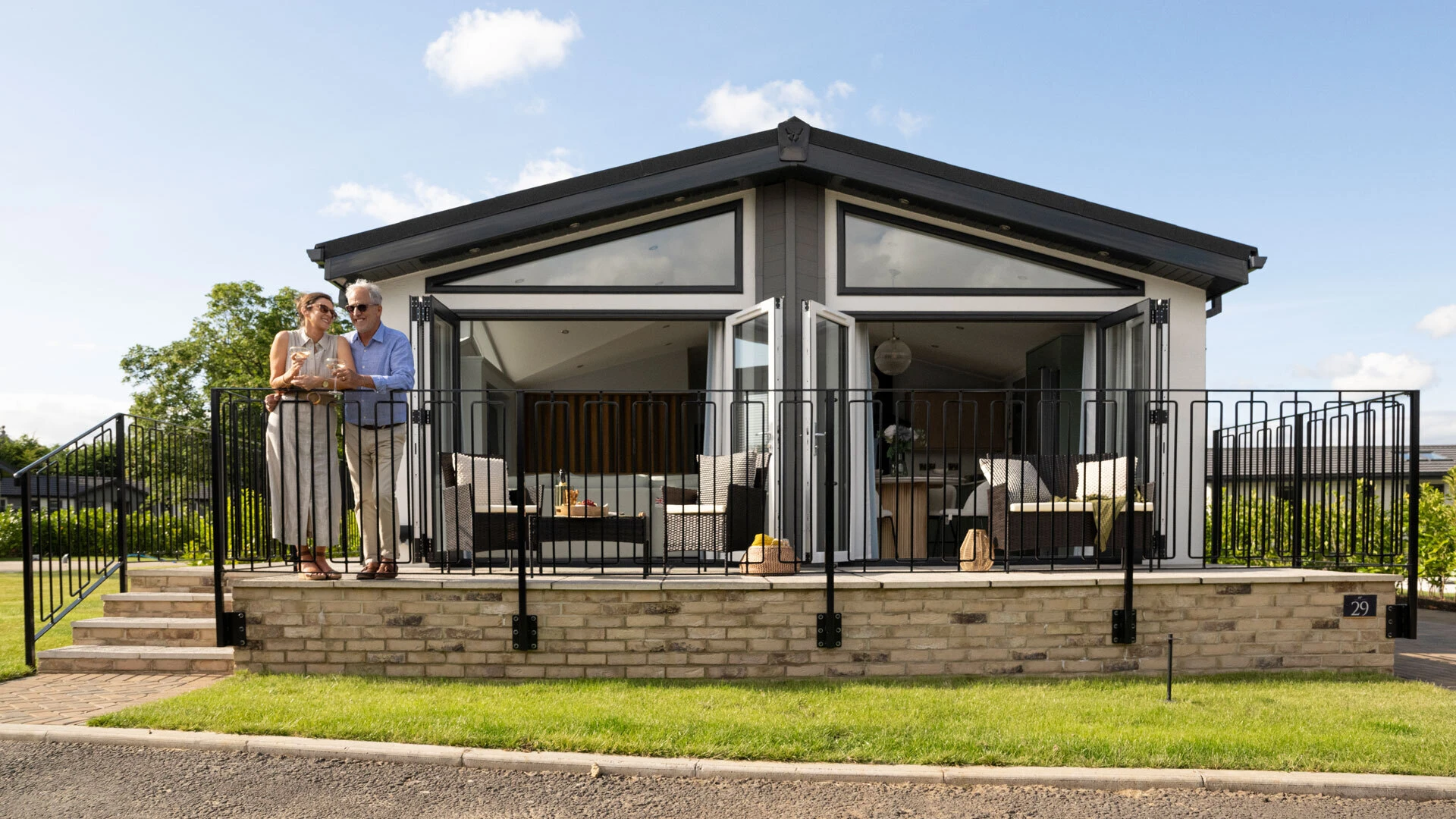 Models on balcony of The Merley Website Header